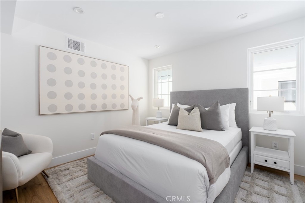 1025 West Balboa Boulevard Newport Beach, CA 92661 - Photo 46 of 70 a bedroom with a bed and a couch