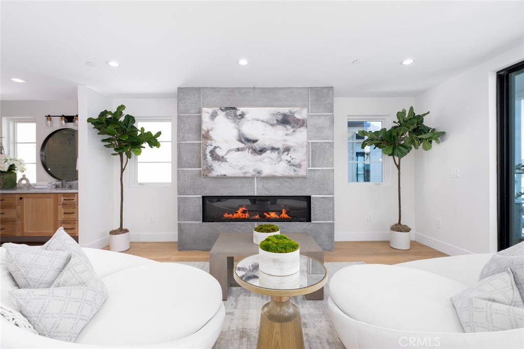 1025 West Balboa Boulevard Newport Beach, CA 92661 - Photo 52 of 70 a living room with furniture flowerpot and a fireplace