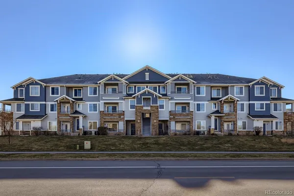 a front view of residential houses with street