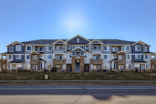 a front view of residential houses with street