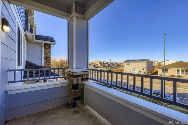 a view of a balcony with chairs