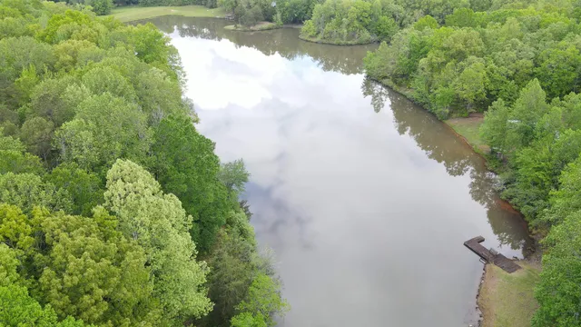 a view of a lake with a yard