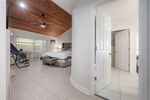 a bedroom with furniture and a chandelier