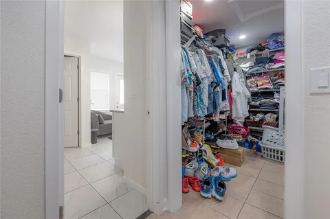 a en suite bathroom with a granite countertop sink and a mirror