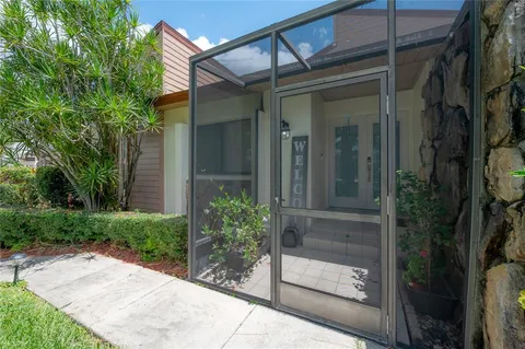 a view of backyard with patio