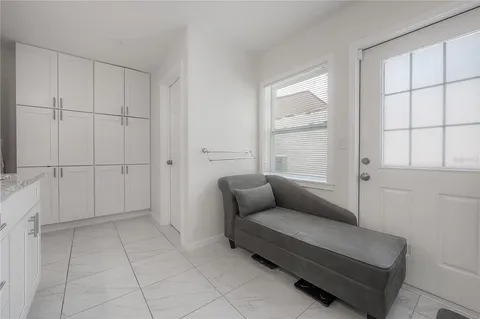 a spacious bathroom with a granite countertop sink a mirror and a vanity