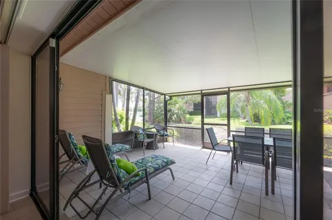 a balcony with furniture and garden view