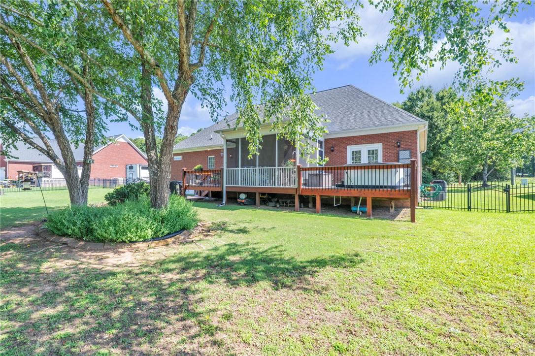 648 Mountain View Road Williamston, SC 29697 - Photo 34 of 42 A spacious backyard with an elevated wood deck and screened porch offers ample outdoor living space.