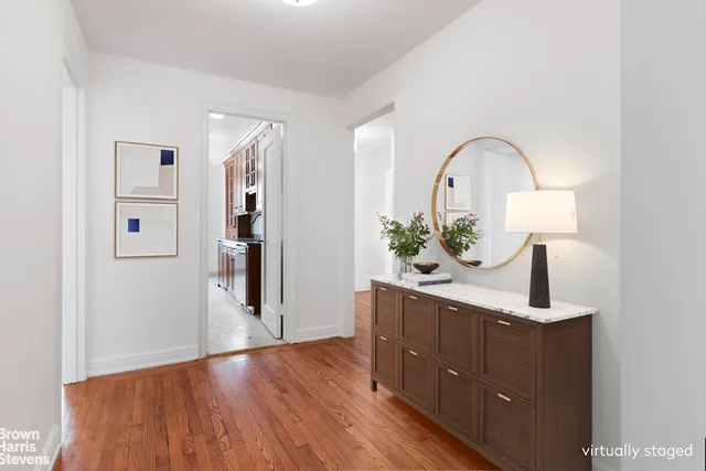 a kitchen with granite countertop a sink a stove and cabinets