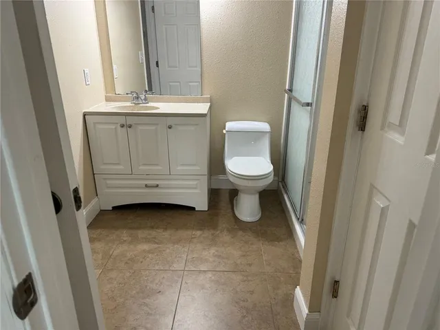a bathroom with a toilet sink and window