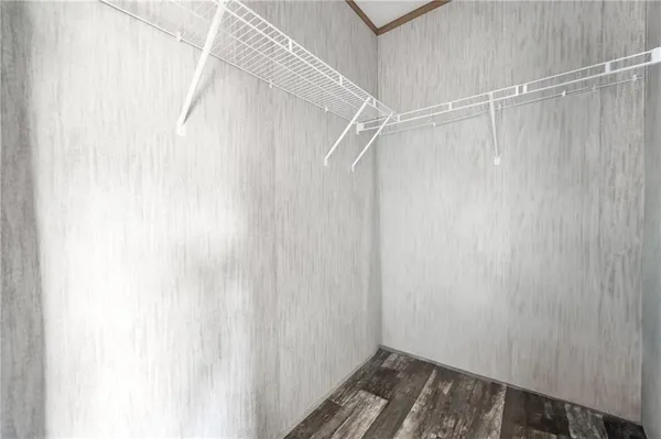 a bathroom with a granite countertop sink a toilet and a mirror