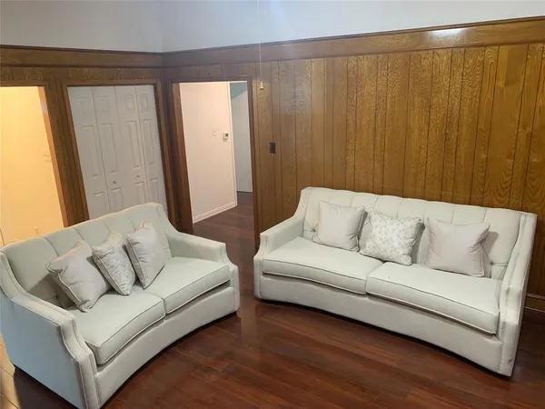 a living room with furniture and a bathtub