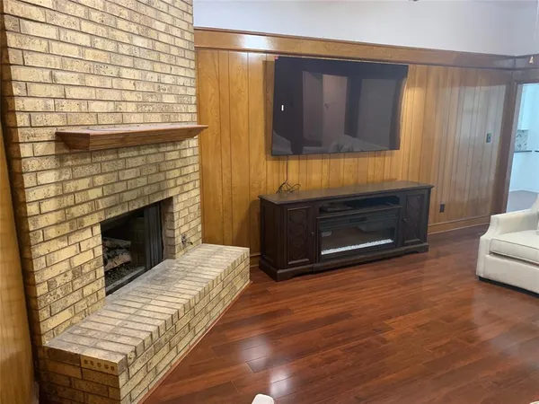 a view of a livingroom with furniture and a fireplace