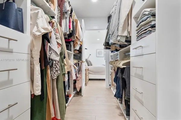 a bathroom with a sink toilet and a mirror