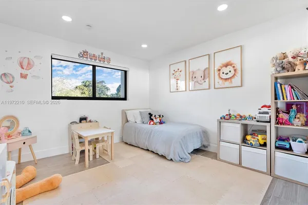 a bathroom with a granite countertop shower a sink and a toilet