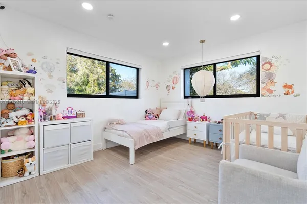 a bedroom with a bed and a chair