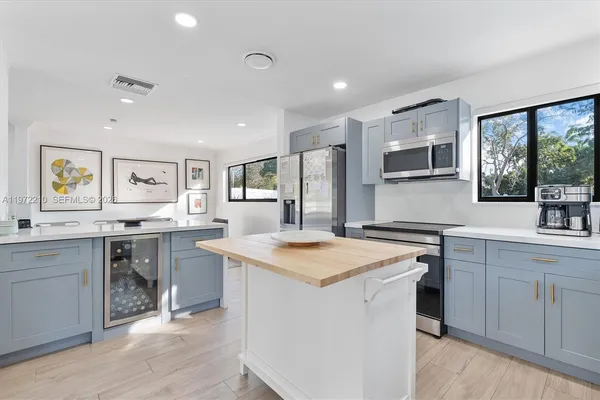 a bedroom with a bed and a large mirror