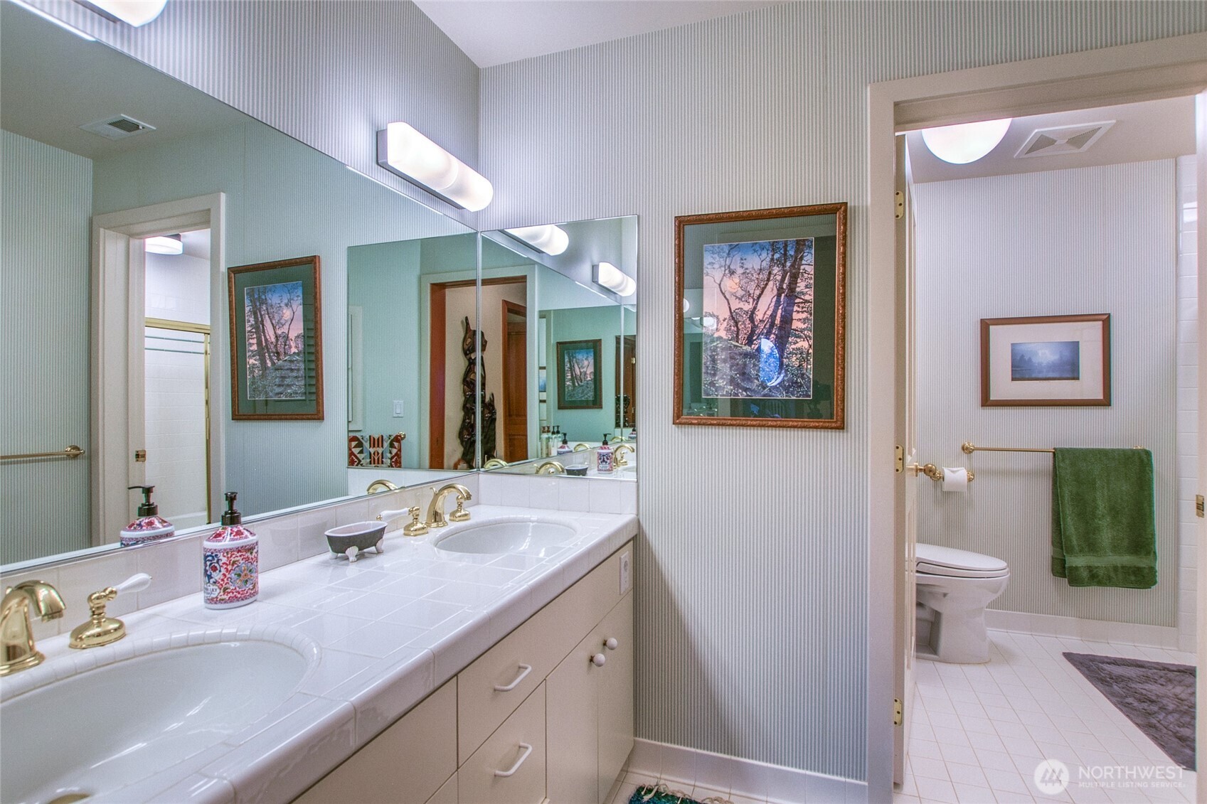 1689 Spring Point Road Orcas Island, WA 98245 - Photo 18 of 40 a bathroom with a granite countertop sink mirror vanity and toilet
