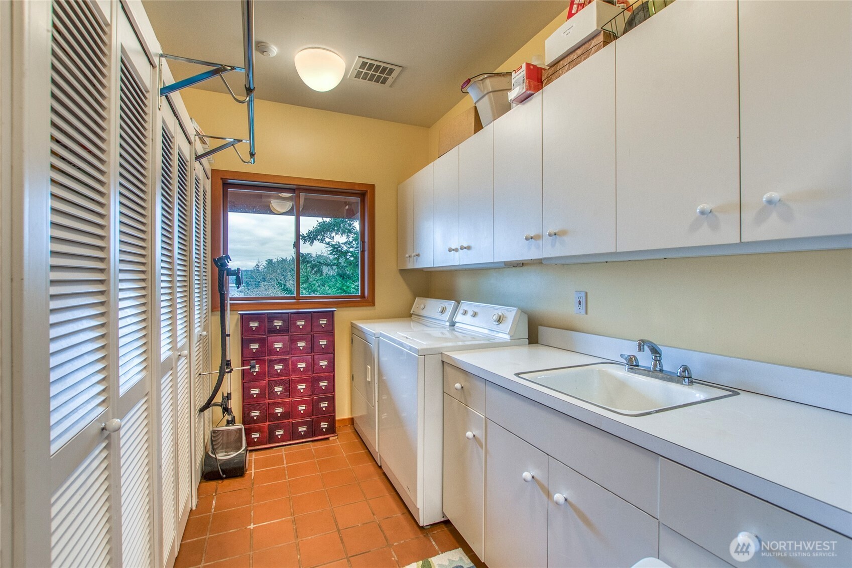 1689 Spring Point Road Orcas Island, WA 98245 - Photo 19 of 40 a kitchen with a sink and cabinets