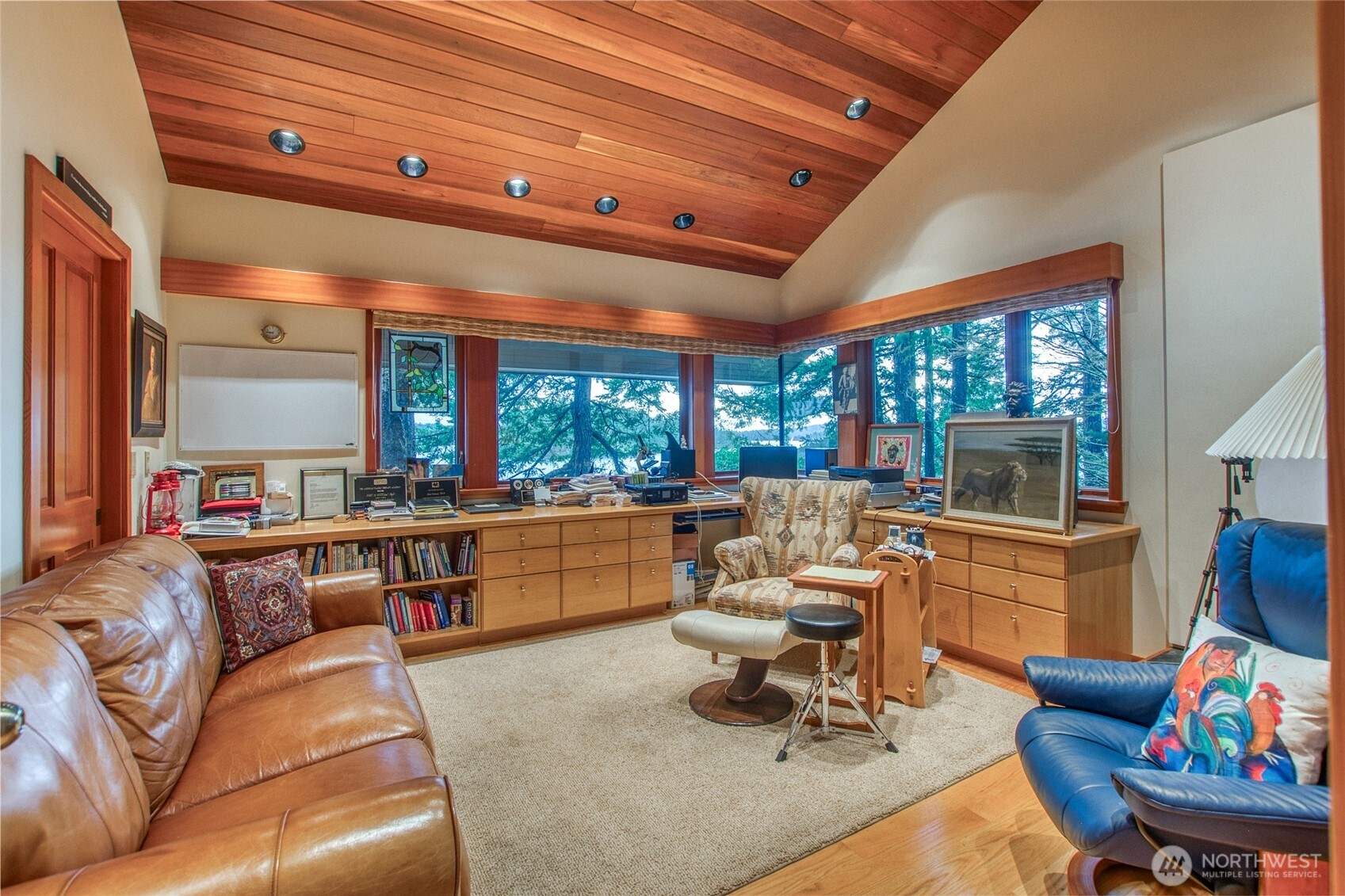 1689 Spring Point Road Orcas Island, WA 98245 - Photo 33 of 40 a living room with furniture a wooden floor and a kitchen view