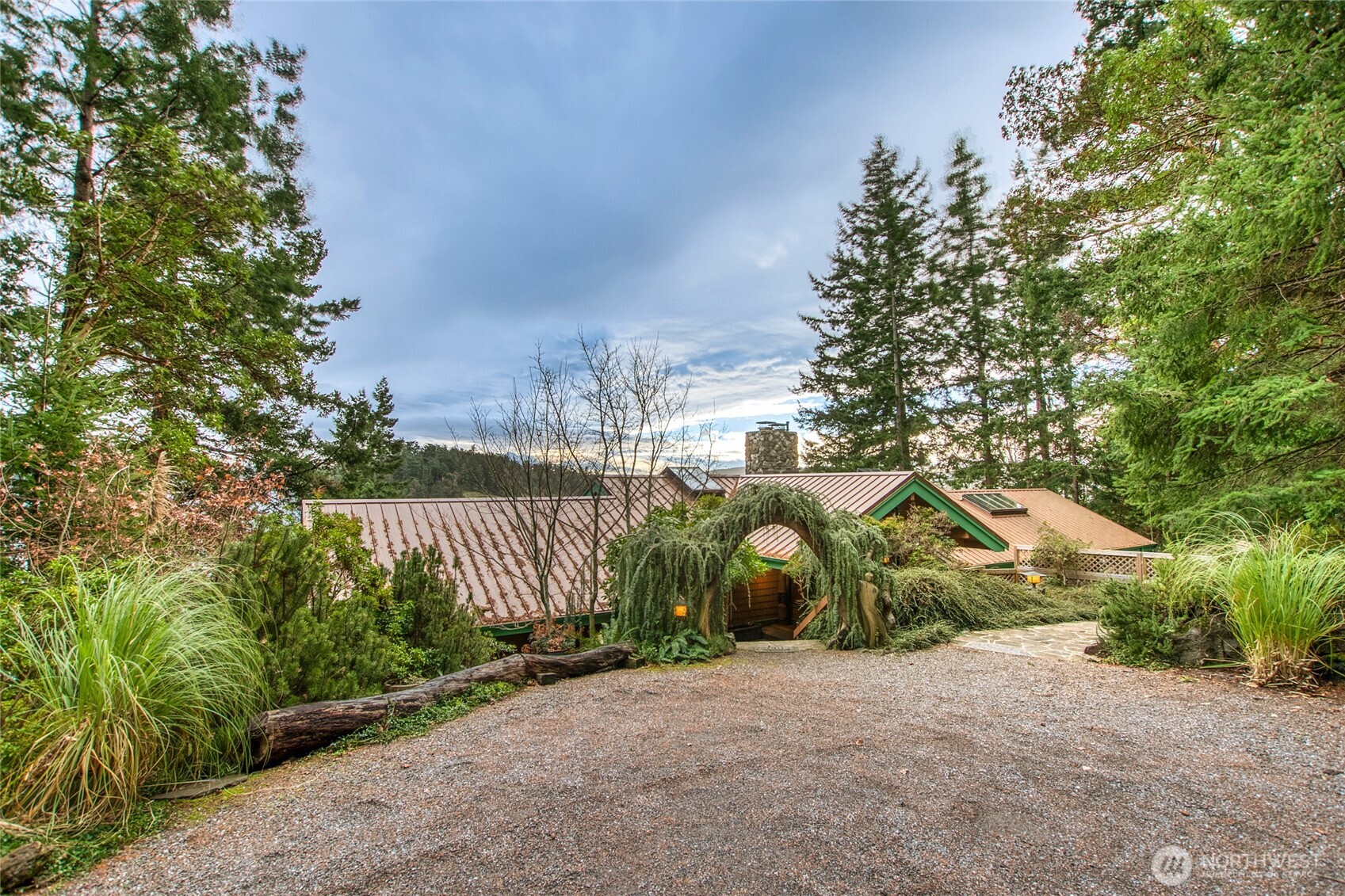 1689 Spring Point Road Orcas Island, WA 98245 - Photo 4 of 40 a view of a park with plants and a bench