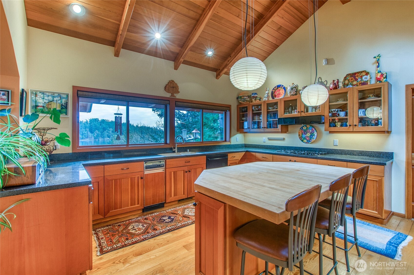 1689 Spring Point Road Orcas Island, WA 98245 - Photo 10 of 40 a view of a dining room with furniture window and wooden floor