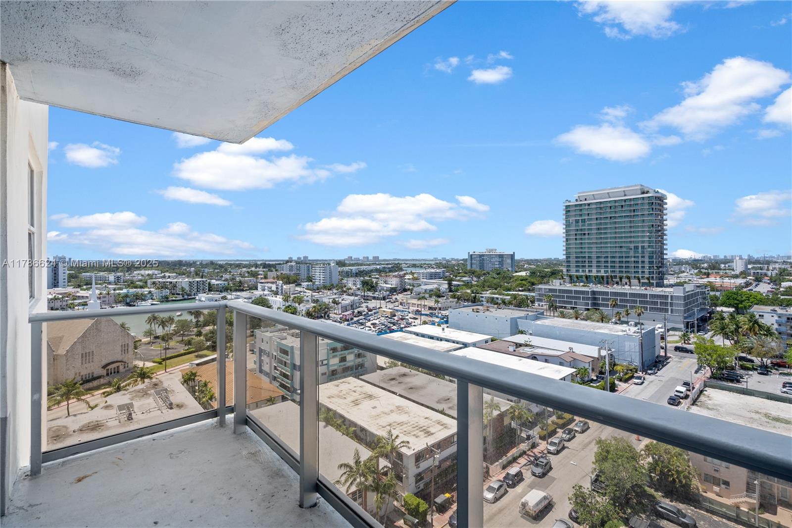401 69th Street, Unit PH101 Miami Beach, FL 33141 - Photo 14 of 25 a view of a city from a balcony with furniture