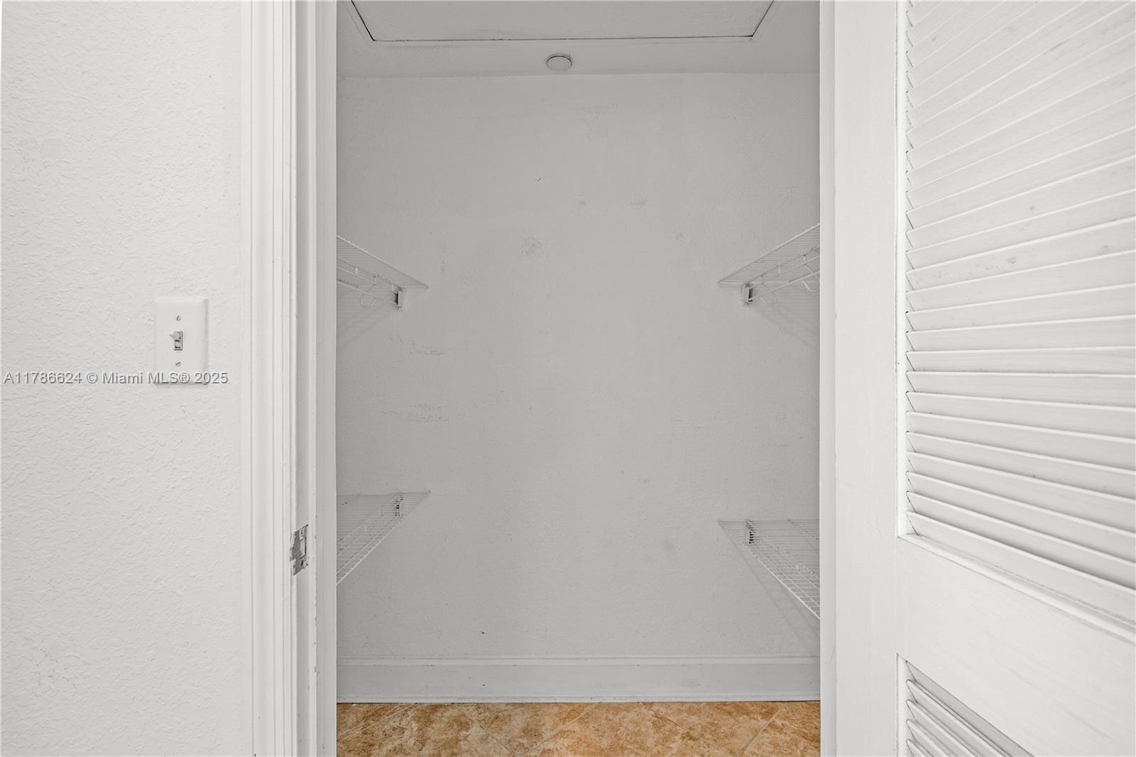 401 69th Street, Unit PH101 Miami Beach, FL 33141 - Photo 23 of 25 a view of a hallway