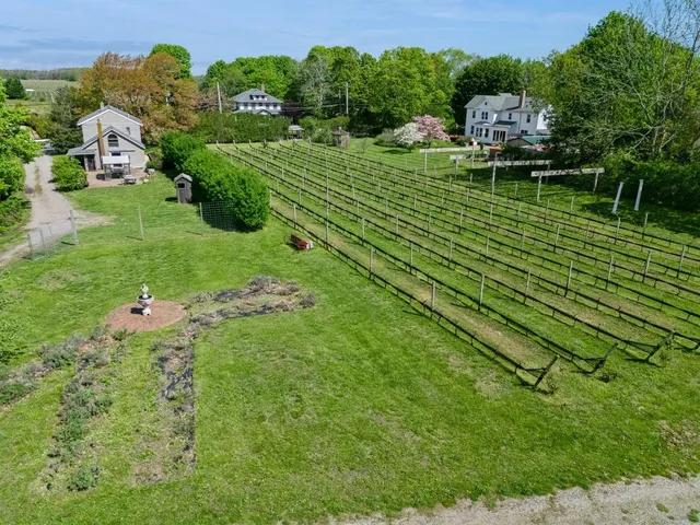 an aerial view of a house with a yard