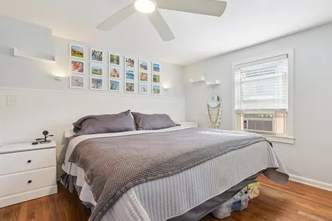 a bedroom with a bed and window