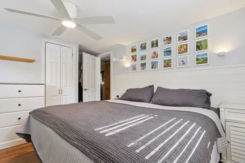 a bedroom with a large bed and a cabinets
