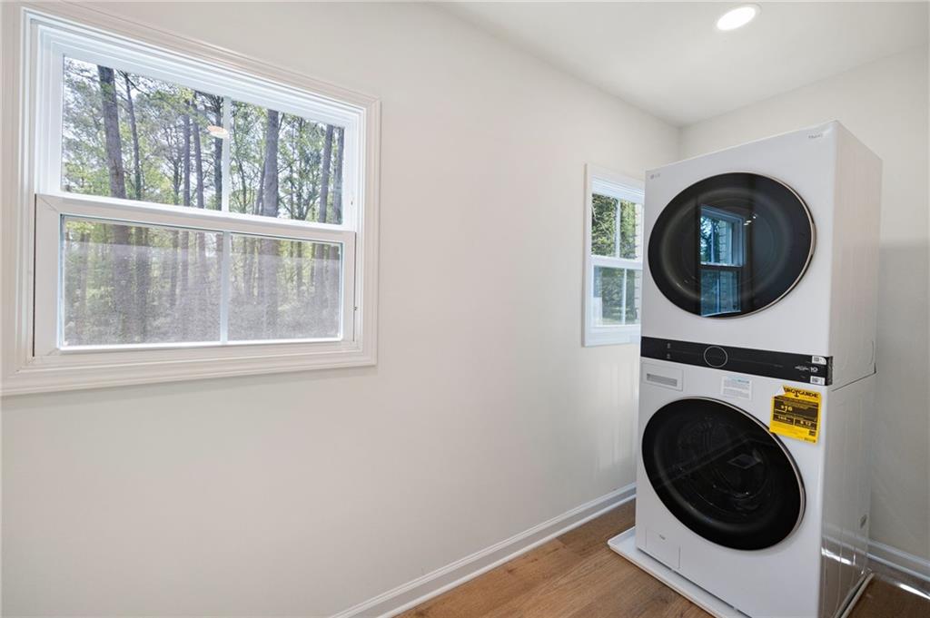 4289 Kimball Road Southwest Atlanta, GA 30331 - Photo 7 of 20 a view of a bedroom with washer and dryer