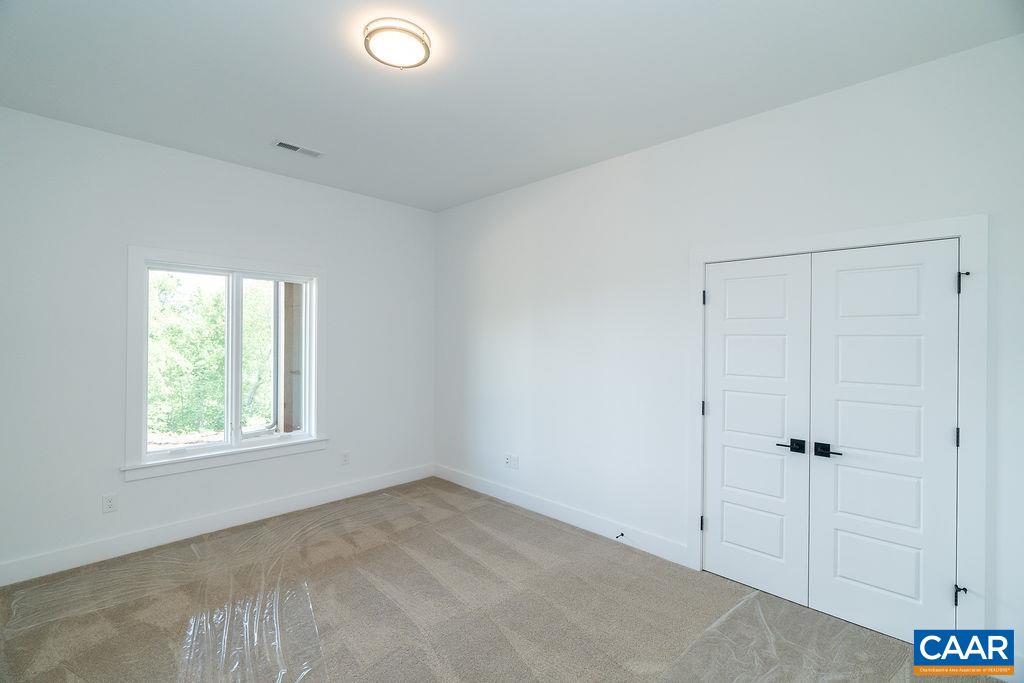 2357 Summit Ridge Trail Charlottesville, VA 22911 - Photo 54 of 70 a view of a livingroom with a white wall & window