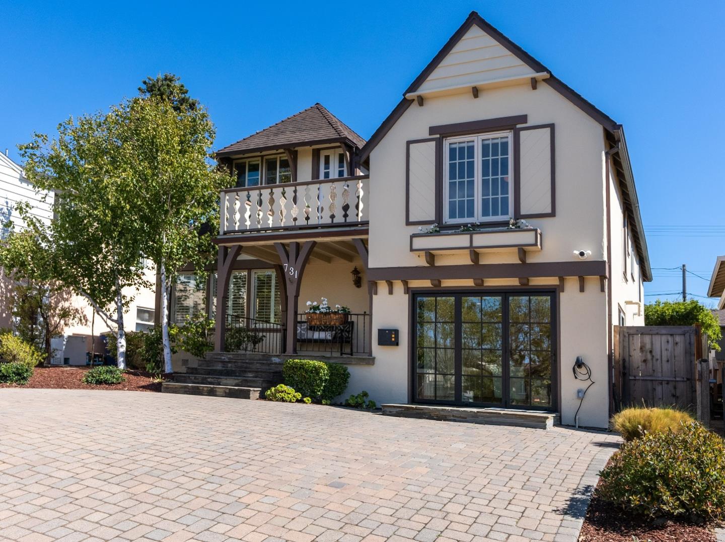 a front view of a house with garden