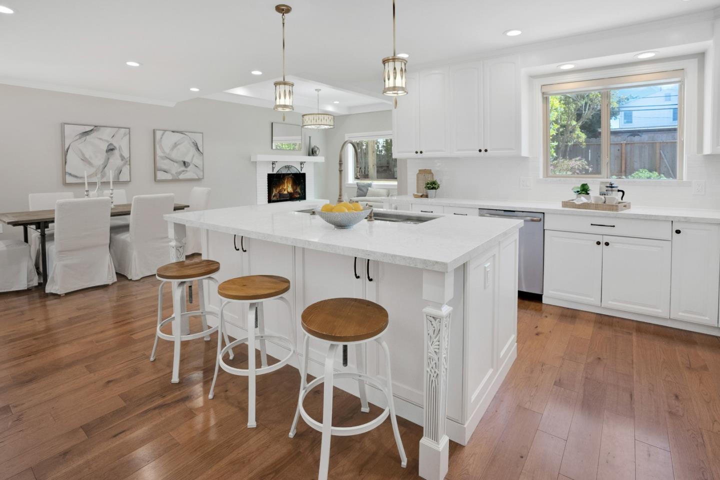 731 Hillcrest Boulevard Millbrae, CA 94030 - Photo 13 of 48 a kitchen with sink cabinets dining table and chairs