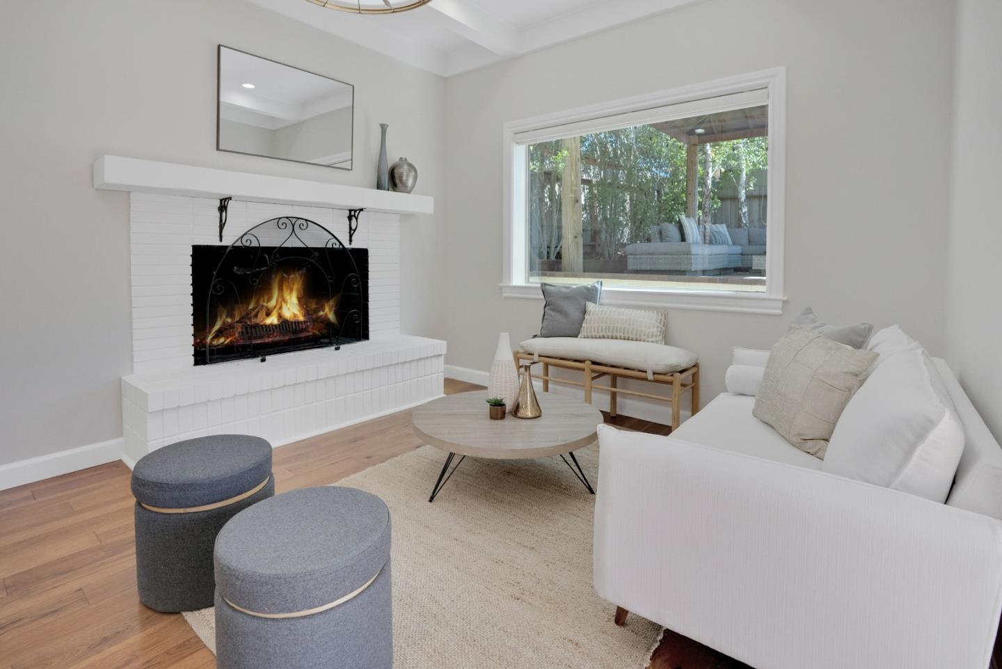 731 Hillcrest Boulevard Millbrae, CA 94030 - Photo 15 of 48 a living room with furniture a fireplace and a floor to ceiling window