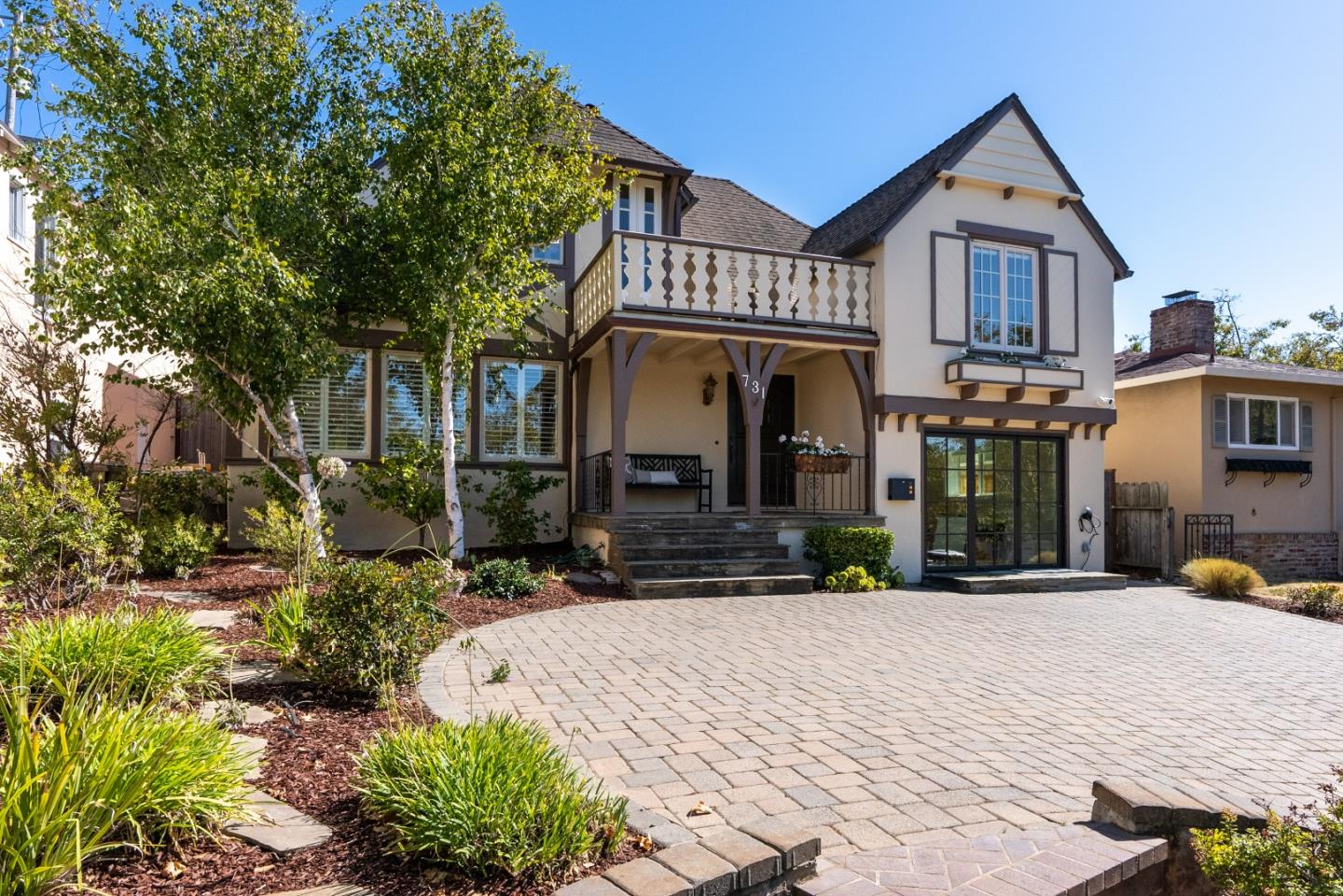 731 Hillcrest Boulevard Millbrae, CA 94030 - Photo 2 of 48 a front view of a house with a yard and potted plants
