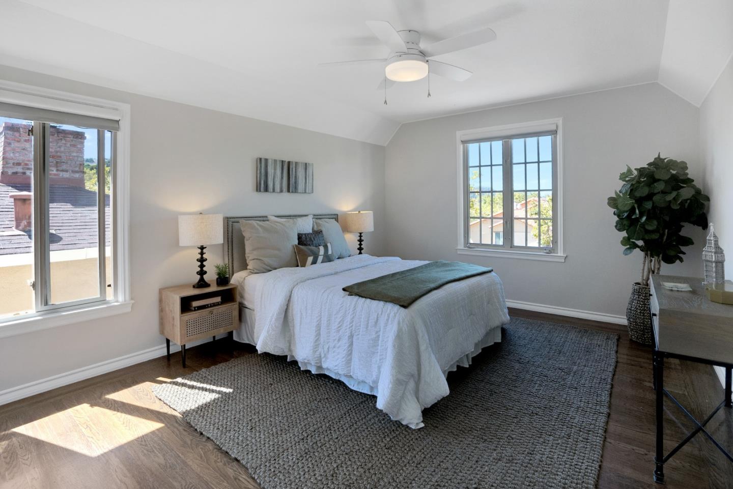 731 Hillcrest Boulevard Millbrae, CA 94030 - Photo 23 of 48 a bedroom with a bed lamp closet window and a potted plant