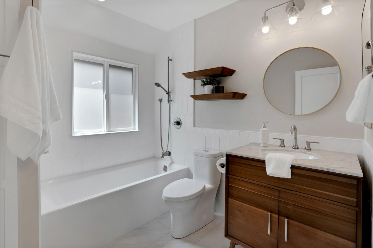 731 Hillcrest Boulevard Millbrae, CA 94030 - Photo 26 of 48 a bathroom with a toilet a sink and mirror