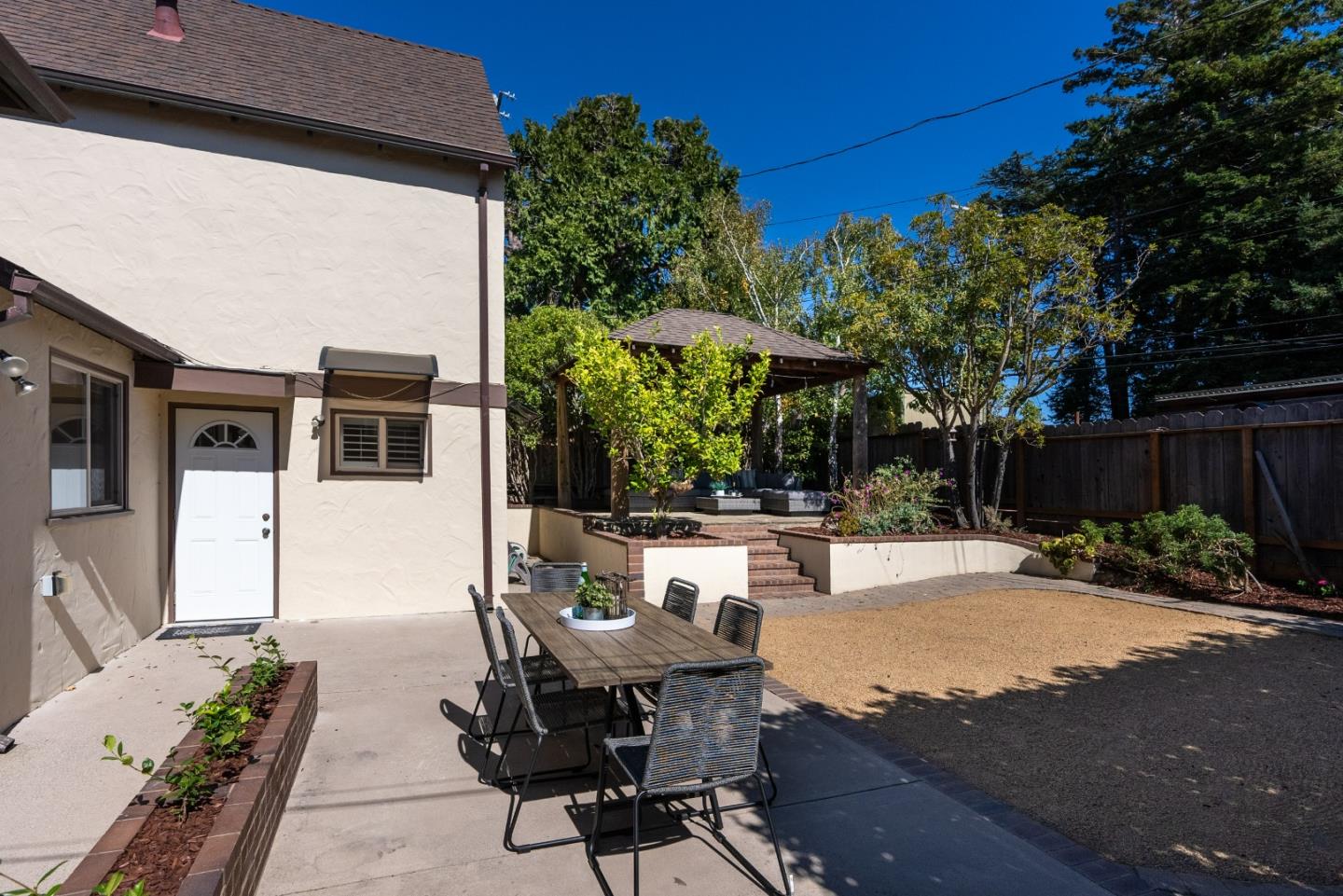 731 Hillcrest Boulevard Millbrae, CA 94030 - Photo 37 of 48 a view of a patio with table and chairs and potted plants