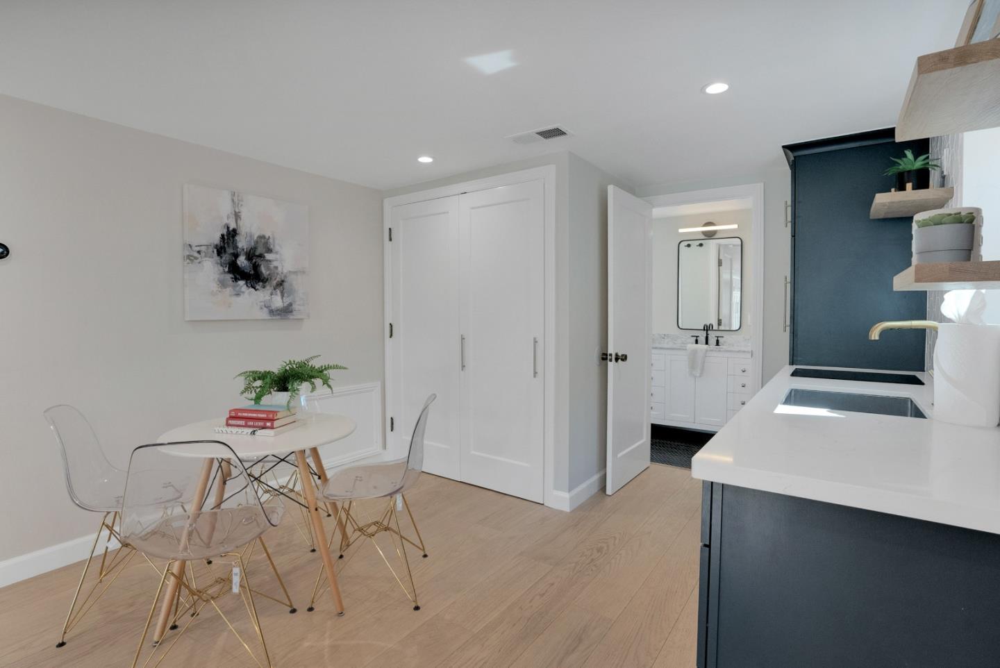 731 Hillcrest Boulevard Millbrae, CA 94030 - Photo 43 of 48 a living room with furniture and a chandelier