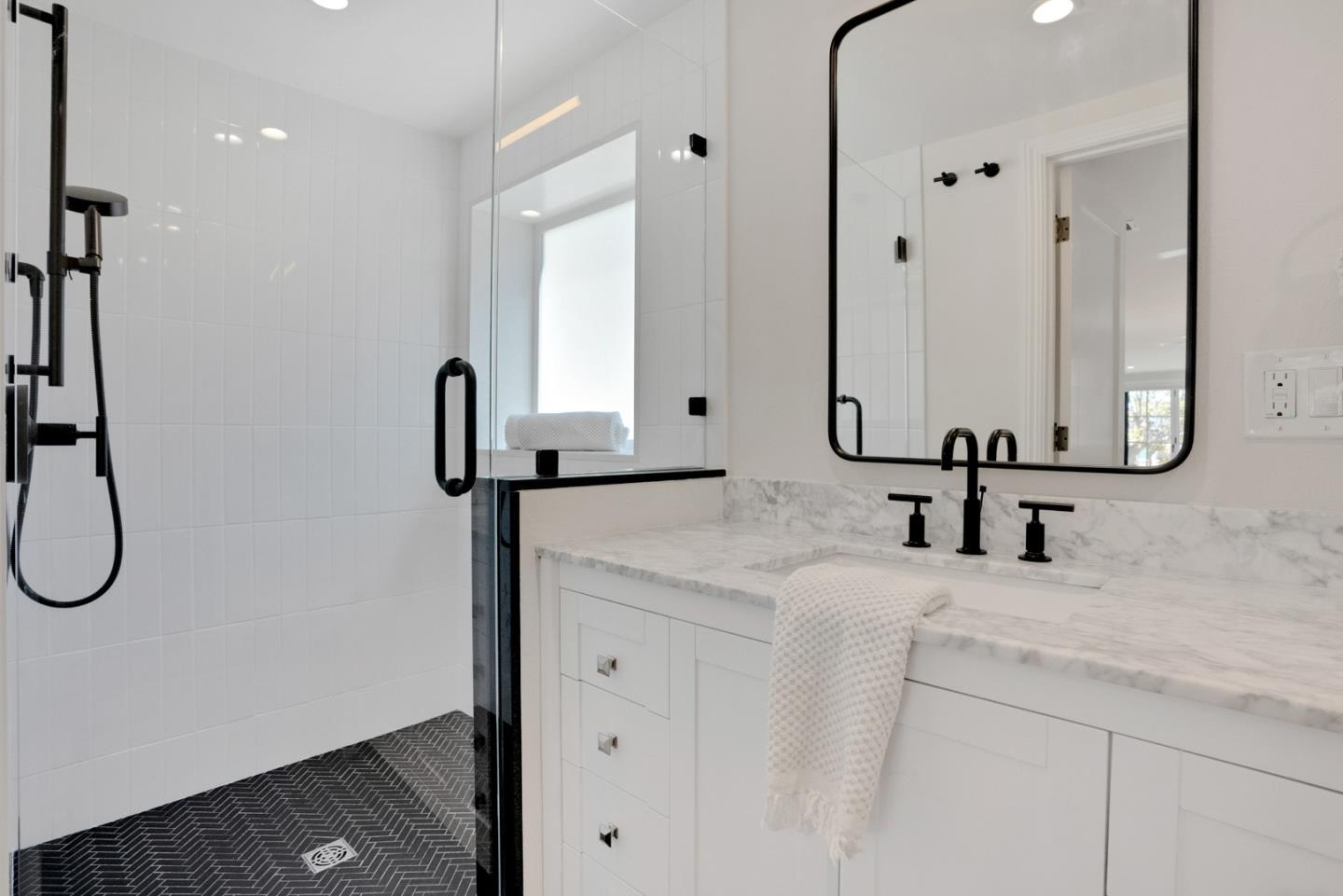 731 Hillcrest Boulevard Millbrae, CA 94030 - Photo 48 of 48 a bathroom with a double vanity sink a mirror and a shower