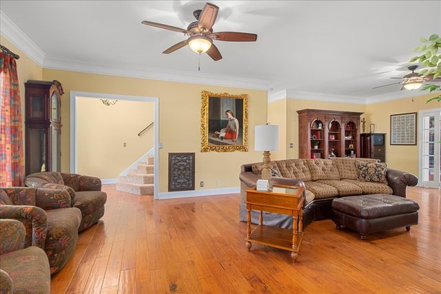 a living room with furniture and a table
