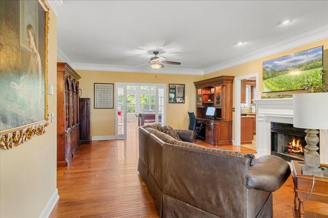 a room with furniture and pool table