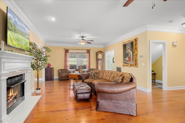 a bedroom with a bed and a chair