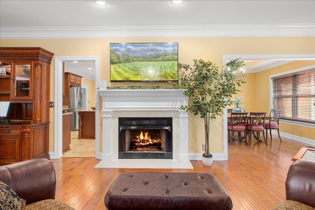 a view of a livingroom with furniture and a flat screen tv