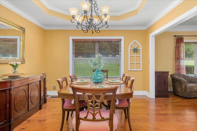 a view of walk in closet with clothes