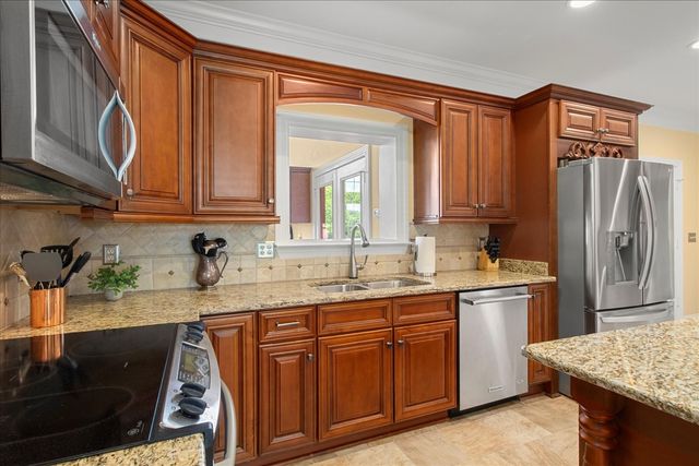 a bedroom with a bed and a potted plant