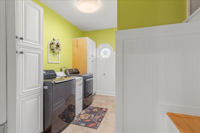 a wooden bench sitting in front of a building