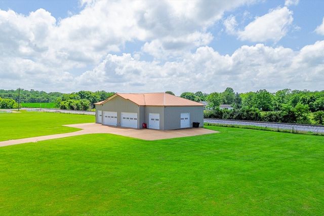 a living room with furniture fireplace and a flat screen tv
